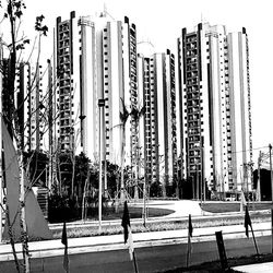 Panoramic view of city street and buildings against sky