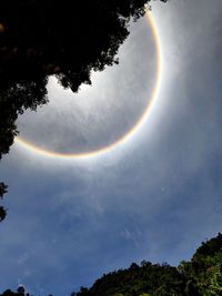 Low angle view of rainbow against sky at night