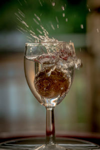 Close-up of wine glass on table