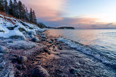 Scenic view of sea against sky during sunset