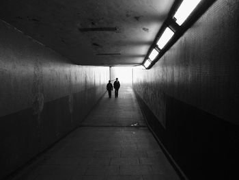 Man in illuminated tunnel