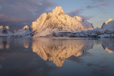 Scenic view of lake against sky during winter