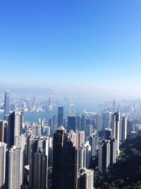 View of cityscape against blue sky