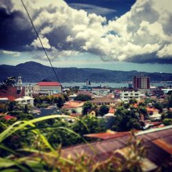 Town against cloudy sky