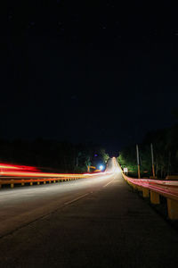 Traffic light trails on highway at night