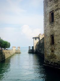 View of sea with buildings in background