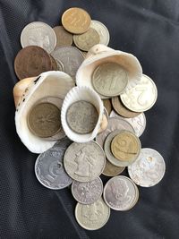 High angle view of coins on table