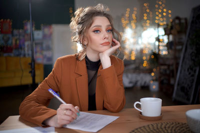 Girl writes on a piece of paper