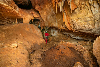 High angle view of man climbing on rock