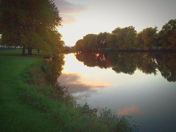 Scenic view of lake against sky during sunset