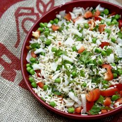 High angle view of rice in plate on jute fabric