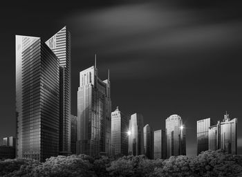 Modern buildings in city against sky