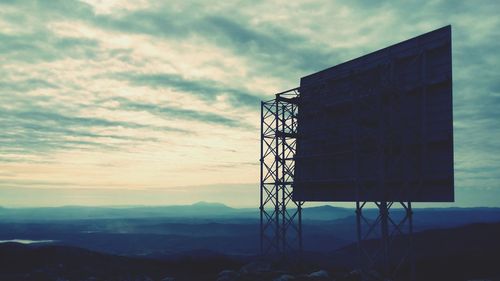 Hoarding against silhouette landscape