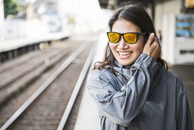 Woman waiting for a train at train station in osaka