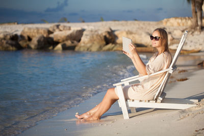 Young woman relaxing on beach