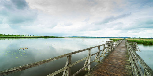 Pier over lake federsee against sky