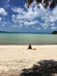 Man on beach against sky