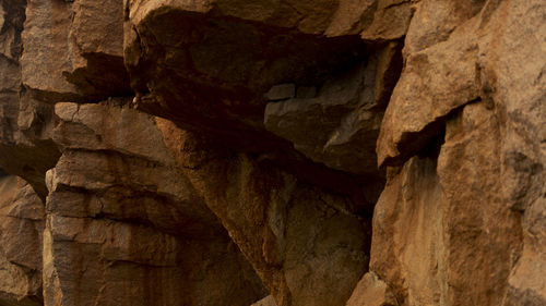 Low angle view of rock formations at cave