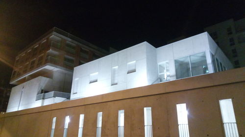 Low angle view of building against sky at night