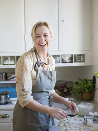 Laughing woman cooking