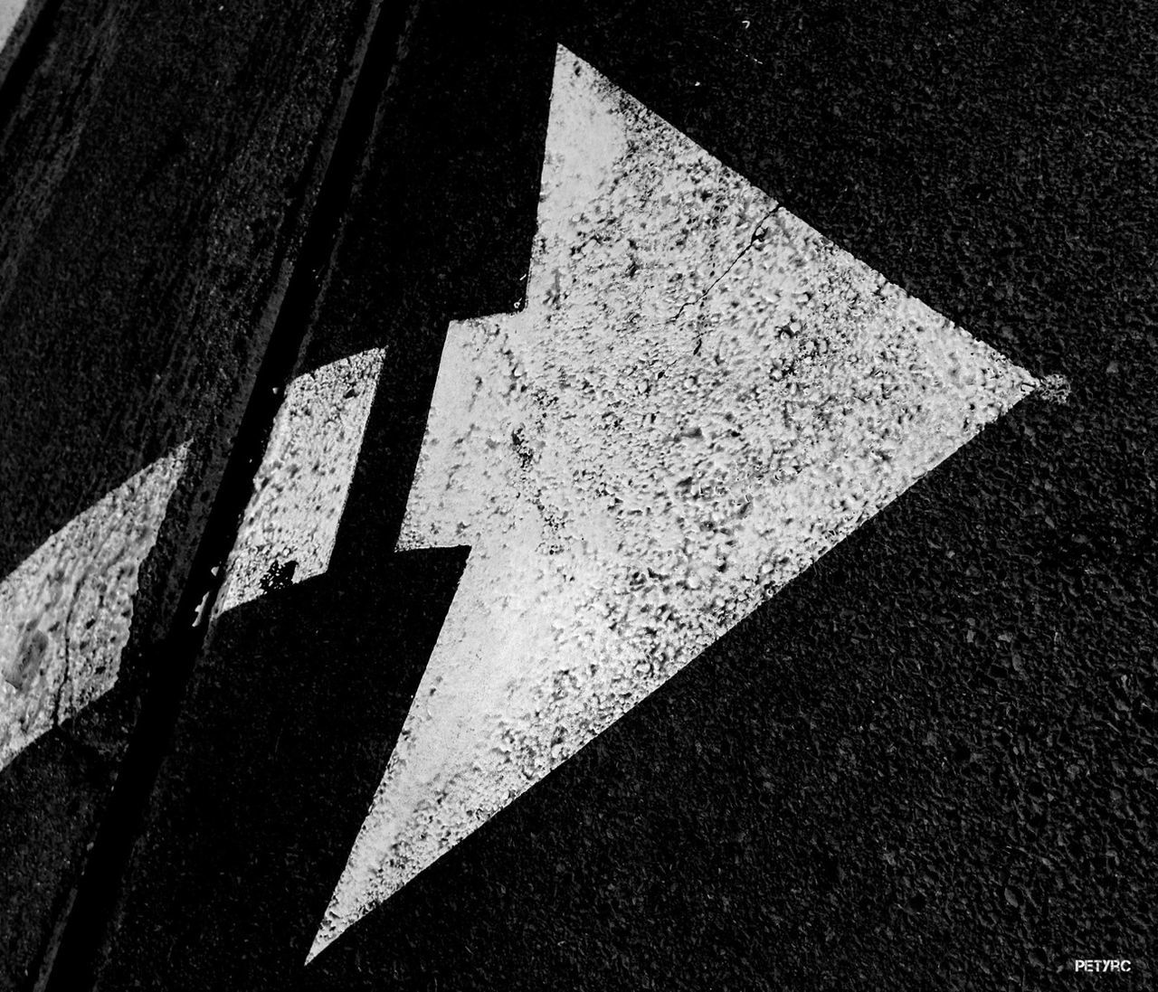 road marking, asphalt, street, guidance, road, transportation, high angle view, arrow symbol, direction, the way forward, directional sign, road sign, zebra crossing, communication, outdoors, sign, no people, day, shadow, sunlight