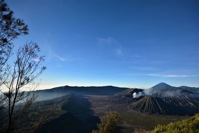 View of volcanic mountain against blue sky