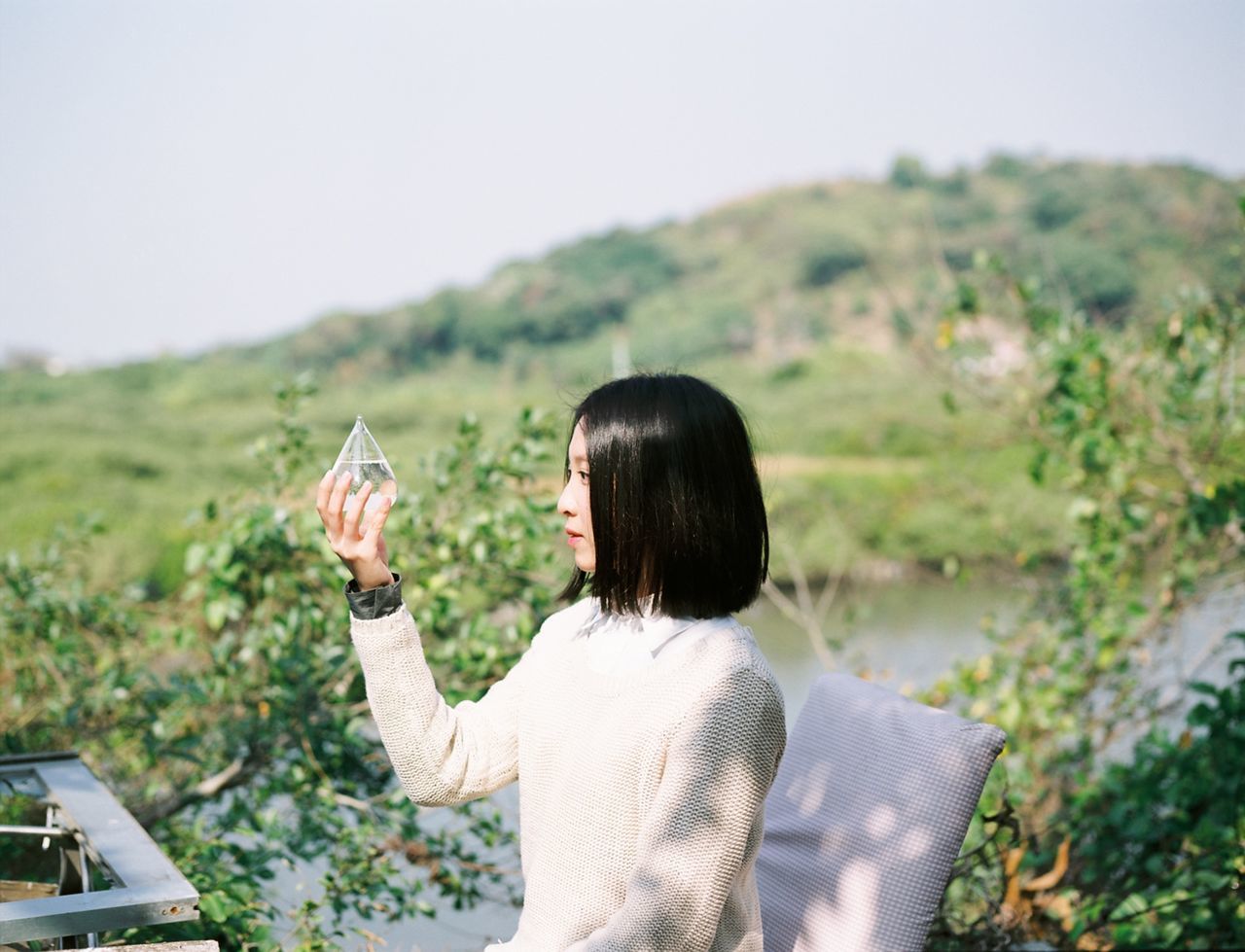 lifestyles, leisure activity, rear view, person, clear sky, landscape, field, focus on foreground, casual clothing, grass, nature, waist up, day, tranquility, long hair, men, sitting, tranquil scene