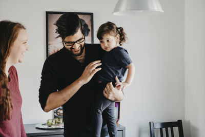 Parents with daughter at home