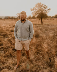 Young man standing on field