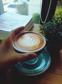 Close-up of coffee cup on table