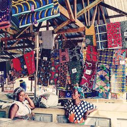 High angle view of people sitting at market stall