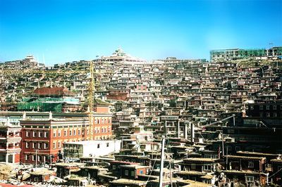 View of buildings against blue sky