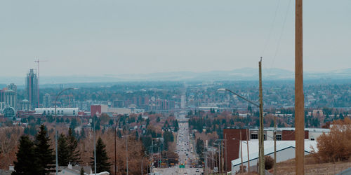 High angle view of buildings in city against clear sky