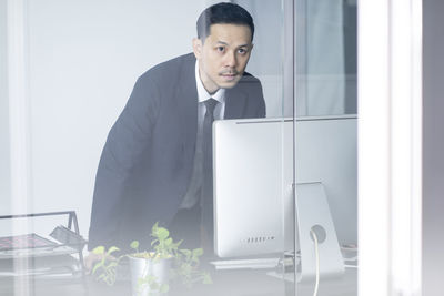 Young man using laptop on table