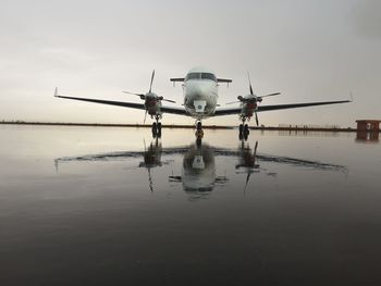 Airplane against sky at dusk