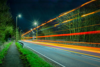 High angle view of light trails on road at night