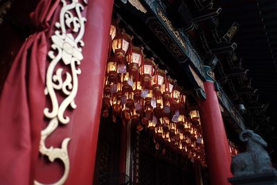 Low angle view of cross hanging in temple
