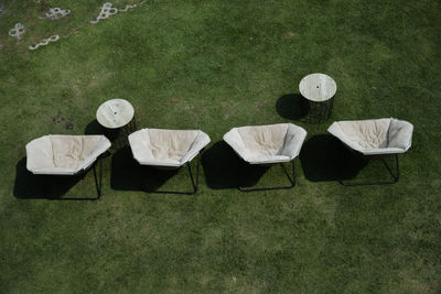 High angle view of chair in lawn