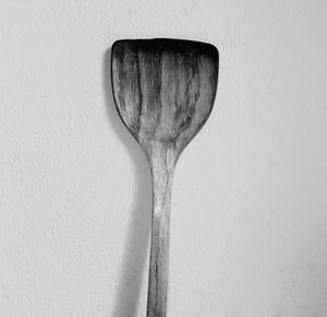 Directly above shot of spatula against white background