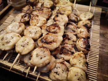 High angle view of meat on barbecue grill