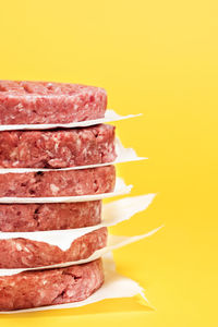 Close-up of food on table against yellow background