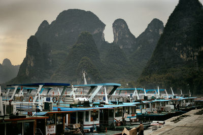 Boats moored at harbor