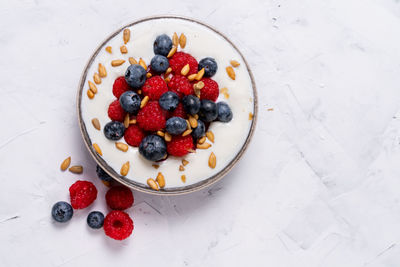 High angle view of strawberries in bowl on table