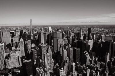 High angle view of city buildings against sky