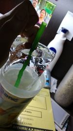 Cropped image of woman holding camera