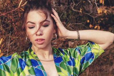 Portrait of young woman looking away