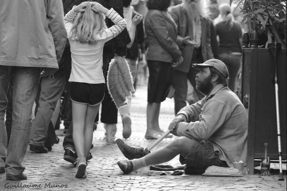 men, person, togetherness, lifestyles, casual clothing, large group of people, leisure activity, walking, rear view, street, medium group of people, bonding, city life, day, group of people, standing, full length, city