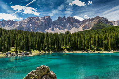 Panoramic view of trees and mountains against sky