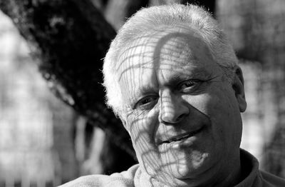 Close-up portrait of man wearing mask outdoors