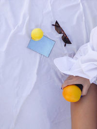 High angle view of hand holding fruit